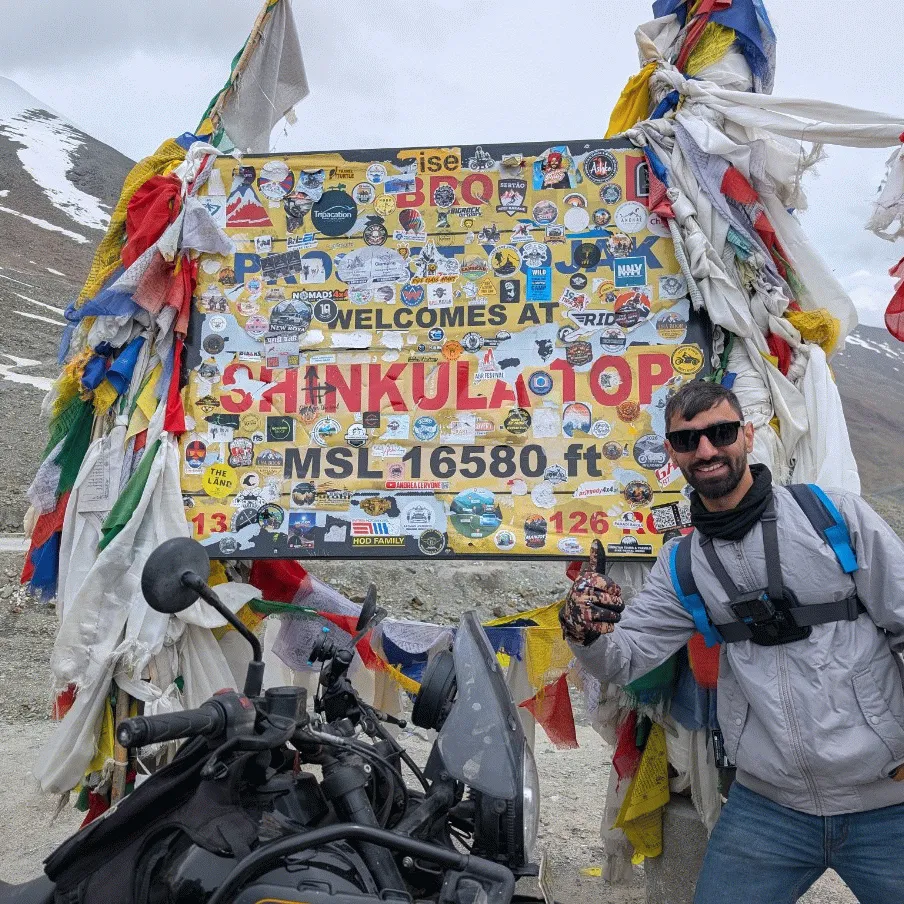 Sachin Upadhyay at Shinkula Top, 16,580 ft, on a Ladakh motorcycle trip